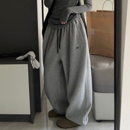 Cotton flannel snow sweatpants with loose silhouette leg binding and floor mopping sports pants